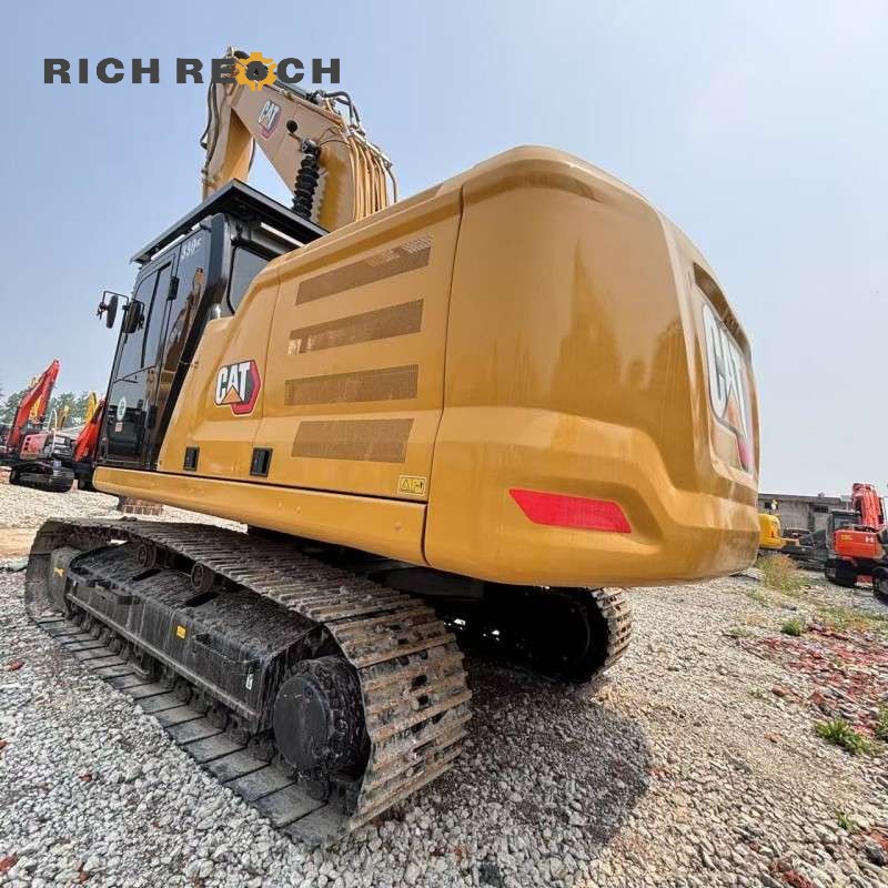 Side profile of a 2021 Cat 330GC excavator showing boom and arm, $79,167 for sale
